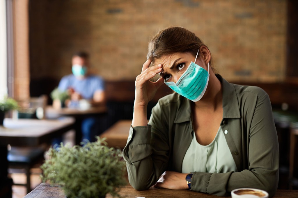 Woman feeling unwell during monsoon season, highlighting common monsoon disease symptoms
